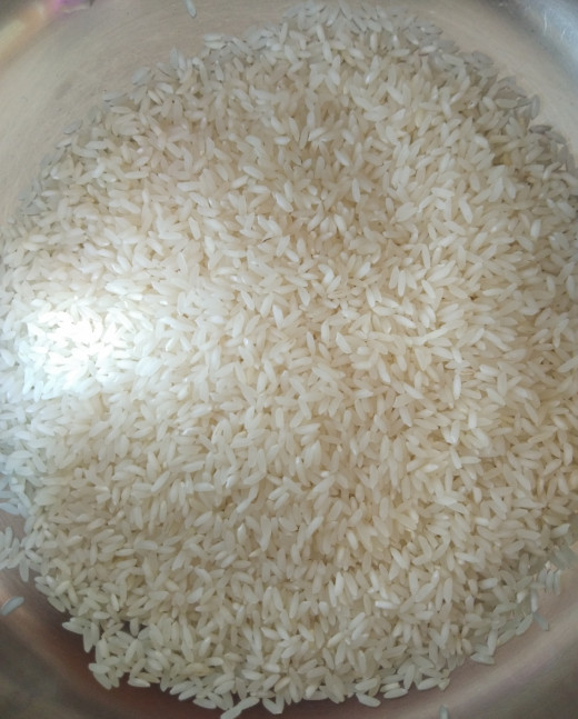 In a bowl take 1 cup of rice. (I used sonamasoori).