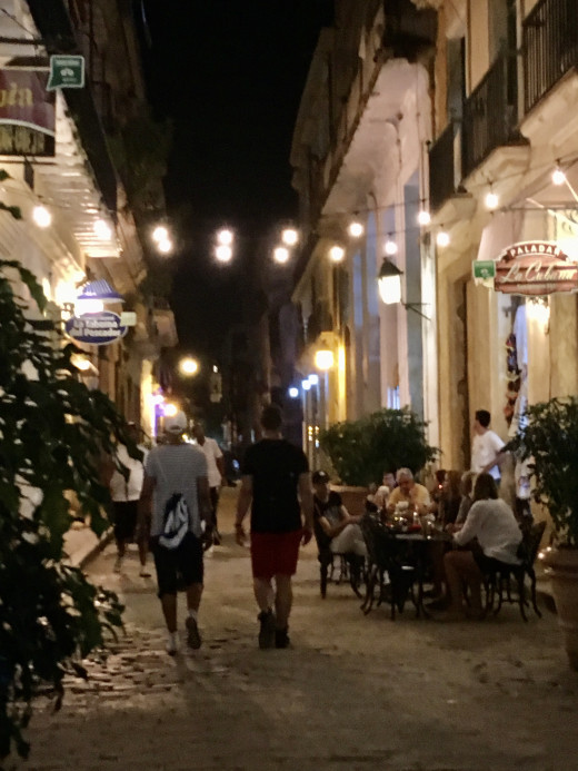 Cuban cobblestone street and outdoor restaurant