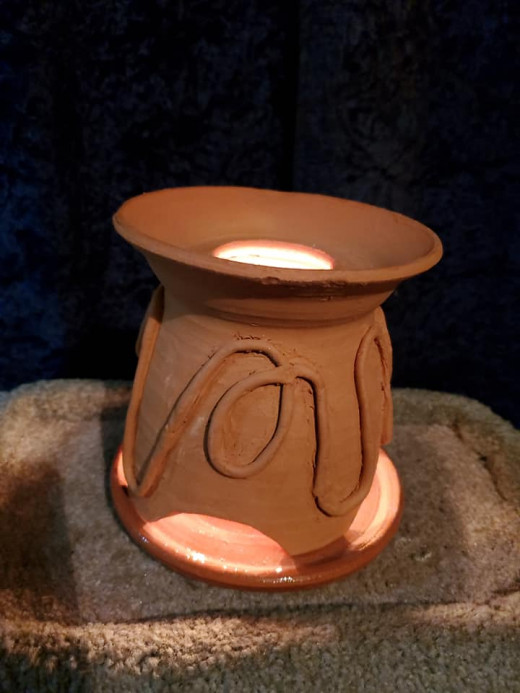 A functioning handmade ceramic candle light heater