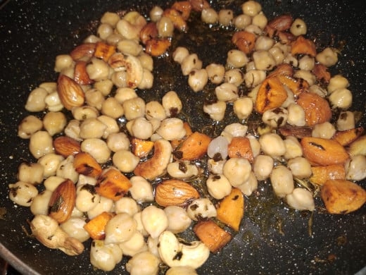 Mix and cook in medium to low flame till both carrots and chickpeas are tender.