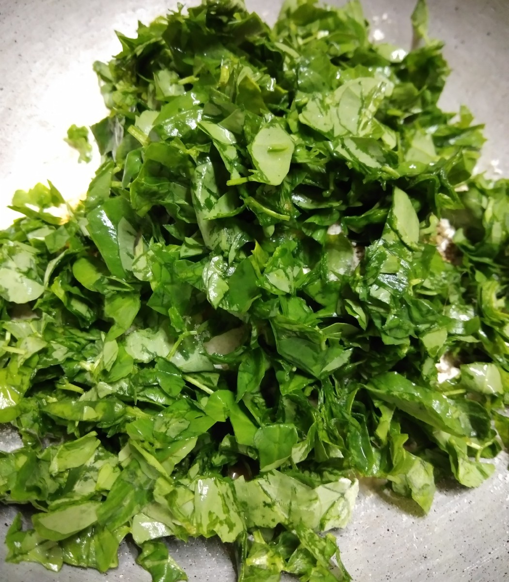 Now finely chop washed and drained fenugreek leaves and add to the wheat flour mixture.