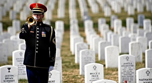 A bugler sounds "Taps" at Arlington National Cemetery on Memorial Day--a solemn occasion, but this holiday doesn't produce much music