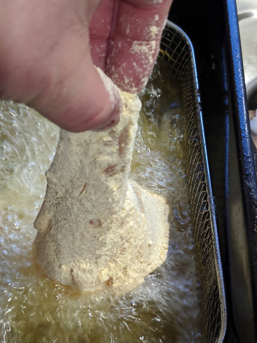 Lower gently into fryer to avoid splashing