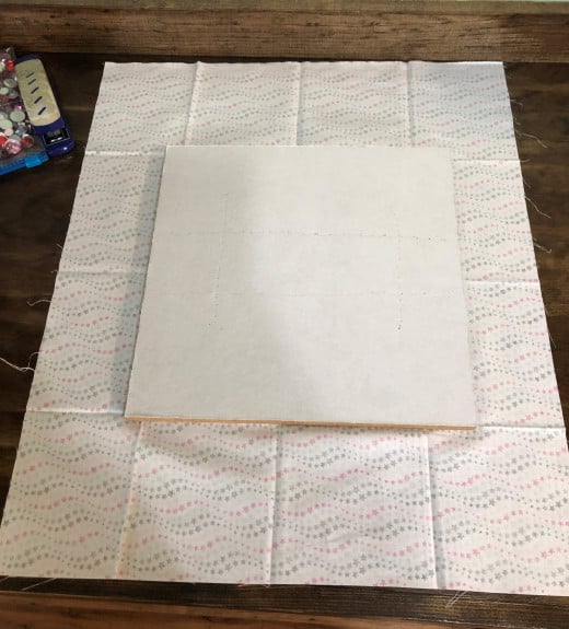 Layout fabric to be larger than board. Cork side facing fabric.
