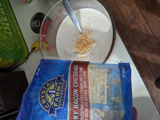 Put some of the shredded cheese directly in the milk soup mixture