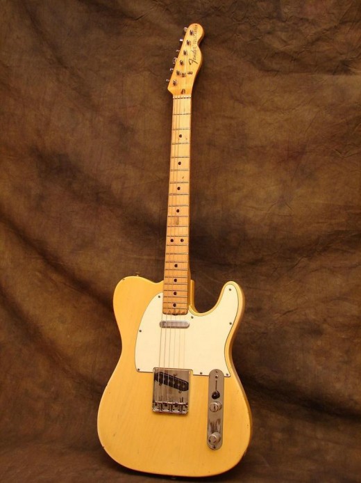 As you can see, maple necks were used again in the 70's and were very popular. Natural wood finished Strats and Teles were very common. Also notice the larger Fender decal and writing on the headstock - a 70's Fender trademark.