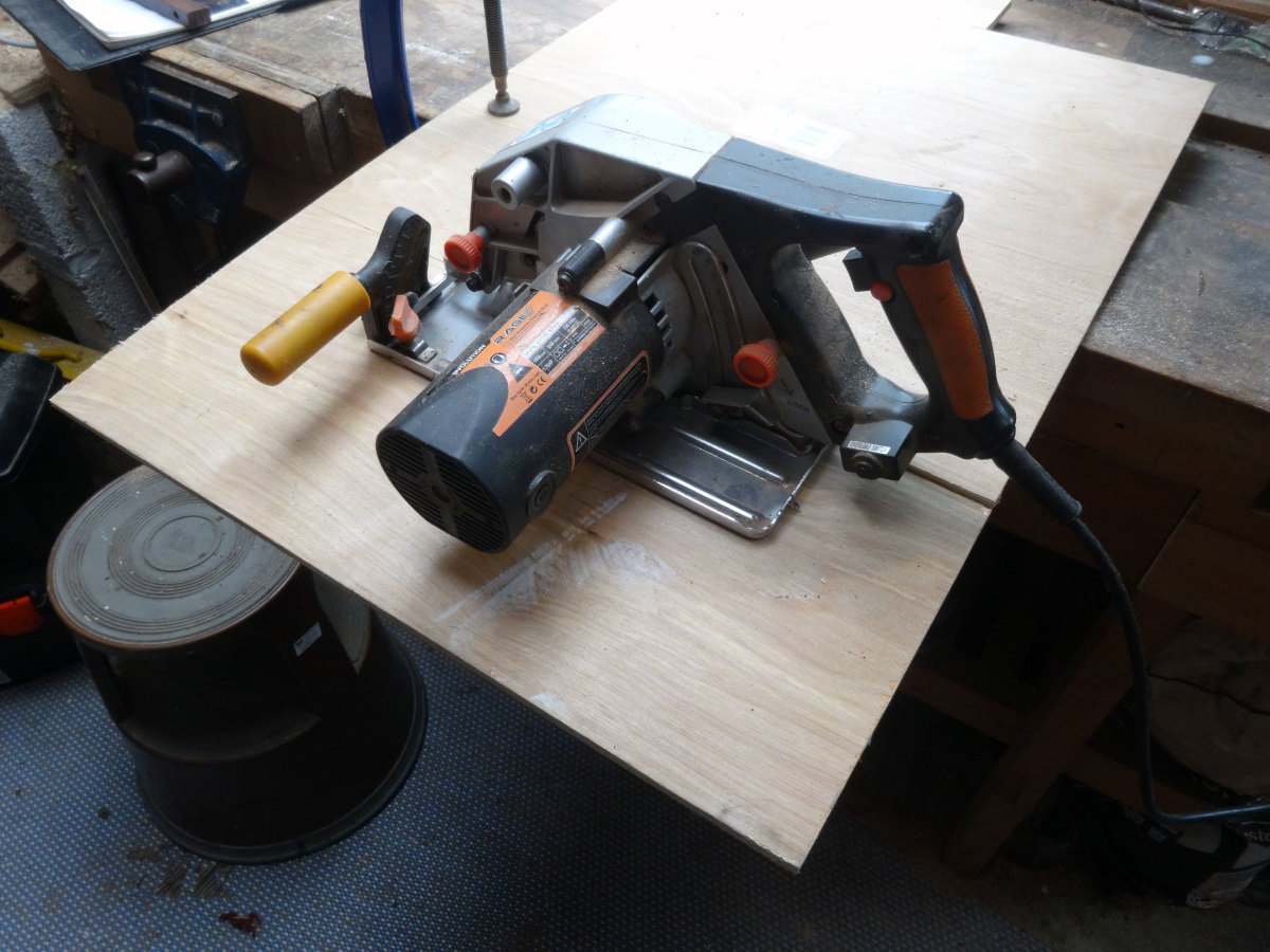 Using a circular saw to cut the plywood to the required width