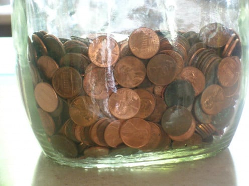 Just like this jar of pennies, getting out of any debt that you have takes time, and a means to save money where you can.