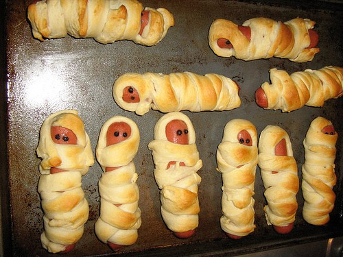 Make little mummies with crescent rolls and smokey links
