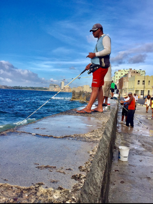 Fishing from the sea wall along Malecón.