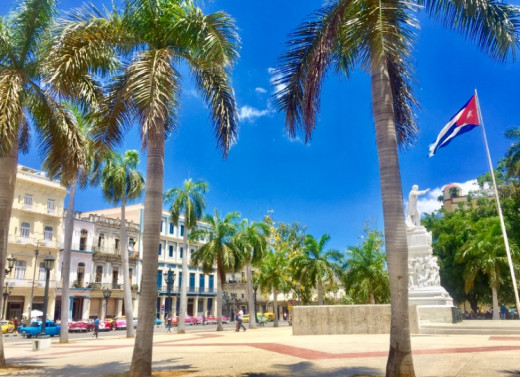 El Parque Central in Havana Vieja. Beautiful architecture, American classical cars and a statue of José Marti, a fighter and symbol for Cubas independence from Spain.