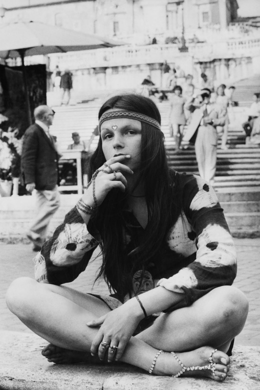 A young hippy wears tie-dye in the 60s