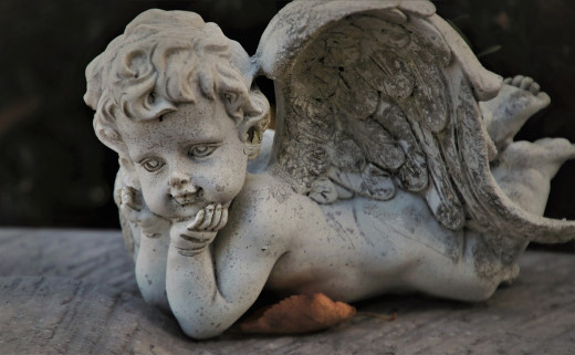 This angel's eyes say it all, "God doesn't love anyone but himself." 