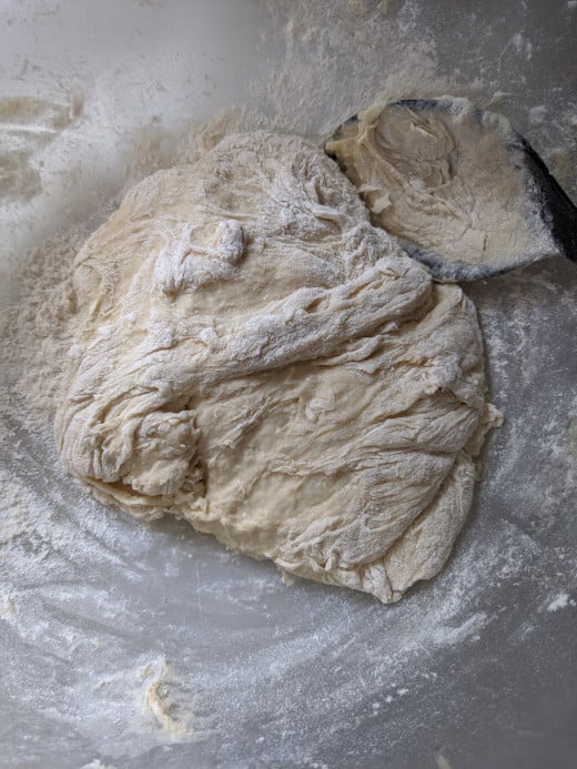Place dough in floured bowl