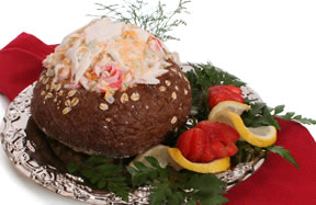 Crab Dip Being Served In A Bread Bowl 
