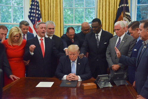 Pastors and the Vice President praying over President Trump - (Jahi Chikwendiu/The Washington Post article 2020/02/14)