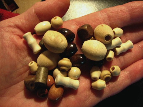 Wooden beads can be purchased in most jewelry supply sections of your local craft store. The variety is seemingly endless.