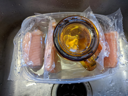 Thawed fish. Open up packages. Remove fish. Discard plastic 