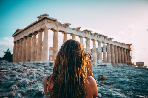 A woman is exploring the city of Athens where the band Septicflash was formed. 