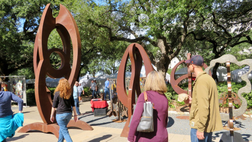 People were walking by sculptures by Eric Ober at the Bayou City Art Festival.