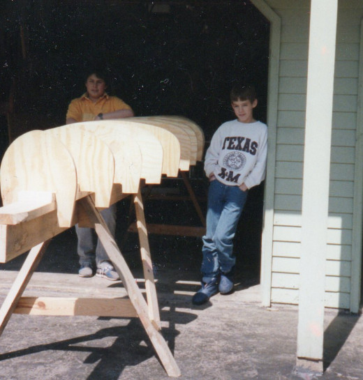 Both the boys standing beside the forms before we begin attaching the cedar strips.