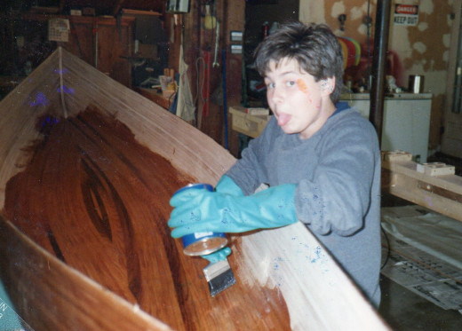 Son, Scott applying the epoxy mixture to the inside of the canoe