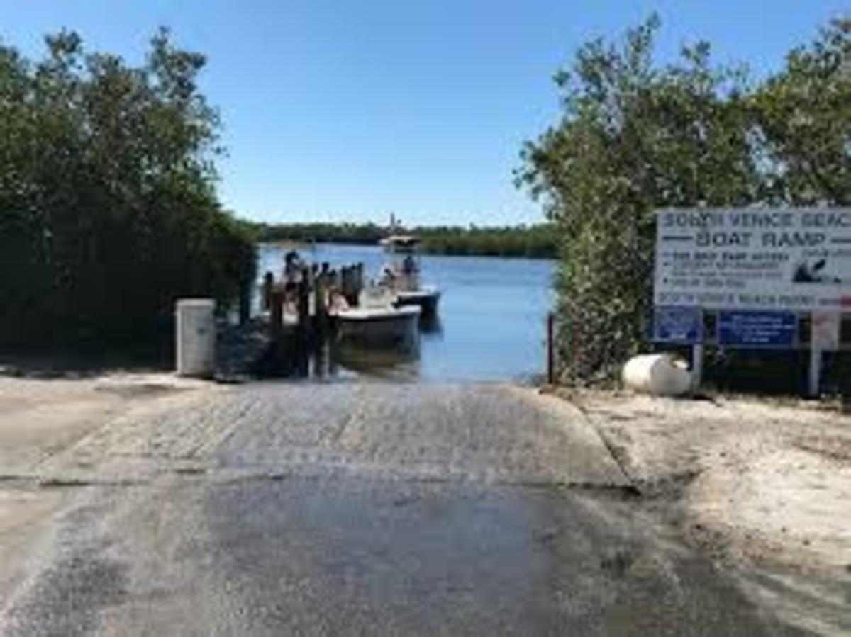 The boat ramp, just to the right of the sign is the kayak launch