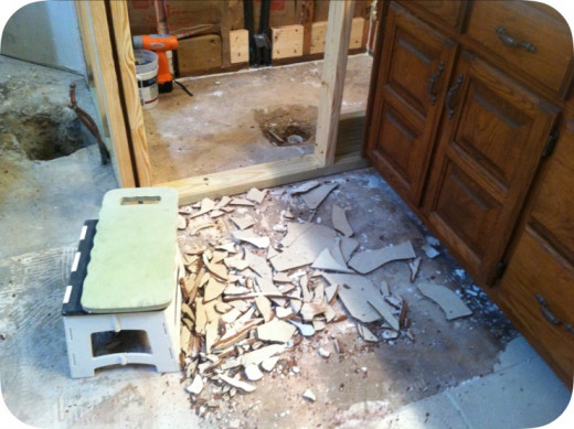 Breaking up tiles and chiseling out tiles