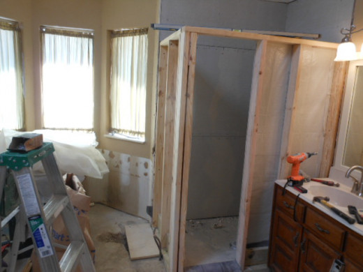 Shower wall with concrete fiberboard attached to the inside walls.