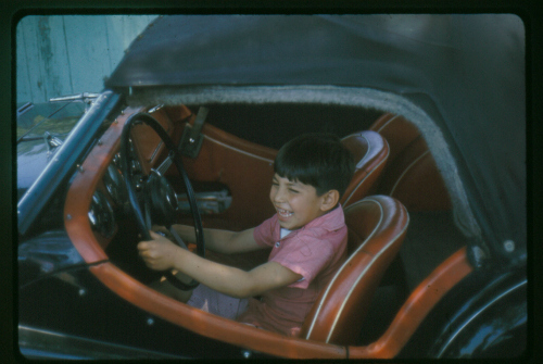 From the grin on his face you can tell that my middle son Mike also liked being behind the wheel of my TR-3.