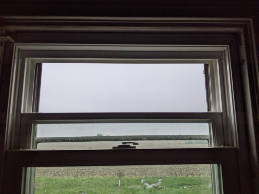 Open window and slide storm window down so exhaust has clear path to outside