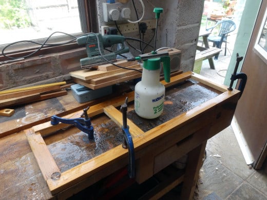 Assembled frame wetted down, clamped, and left overnight to encourage the warped wood back into shape.