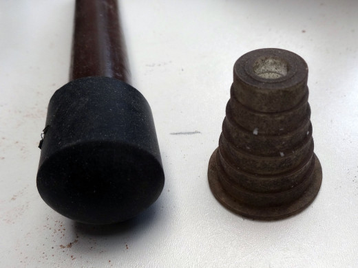Rubber food and rubber stopper salvaged from an old pond pump water feature.