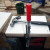 Facing the middle shelves with the white faced hardboard; gluing and tacking them in place with panel pins.