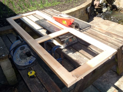 Using my bench saw to trim panel frame’s styles for flush fit to display cabinet.