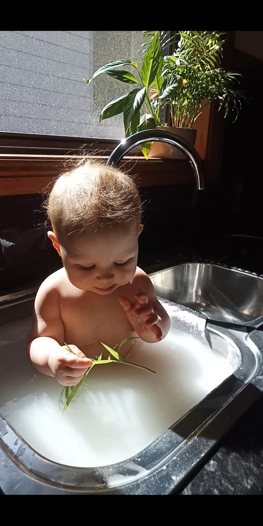 My daughter bathing in coconut milk 