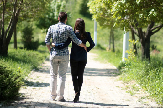 Couple having a cool walk in the garden
