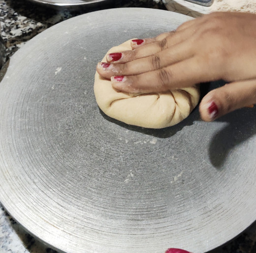 Pressing the stuffed ball