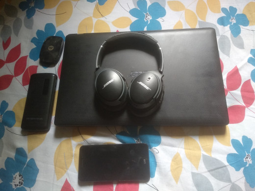 Laptop, headphones, Jio-Fi (mini router), power bank and smartphone