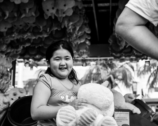 Little girl receiving a stuffed toy