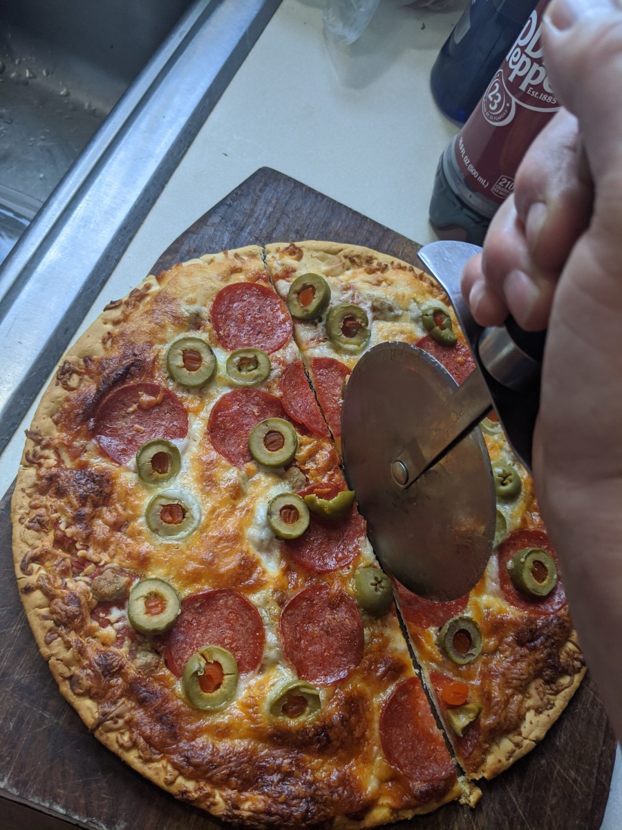 My first cut across the pizza, cut it in two pieces. Each piece was half of the pizza. Half is a math term. It's written 1/2. 1 of 2. the '/' means of.