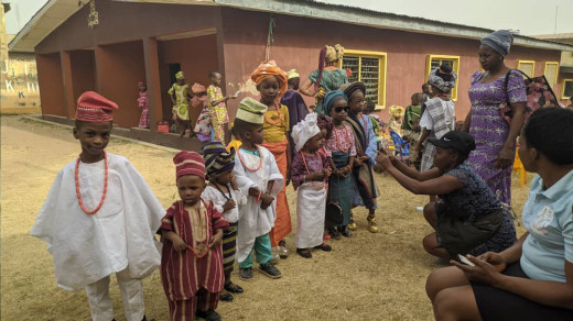 Nigerian Children putting on native dresses on Yoruba cultural day
