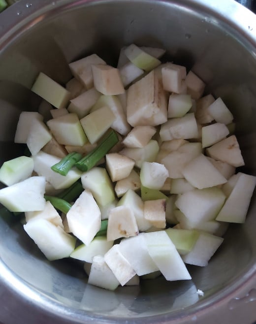 Wash, peel and chop vegetables to desired shape and size. Transfer them to a pot or vessel.