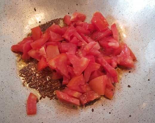 Add chopped tomatoes. 