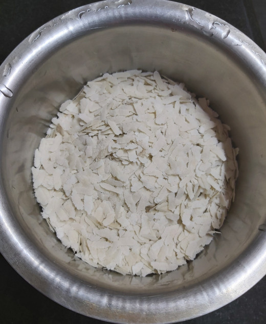 Take 1 cup of flattened rice or poha in a bowl or vessel (I used medium thick poha here. Thin or thick poha can also be used).