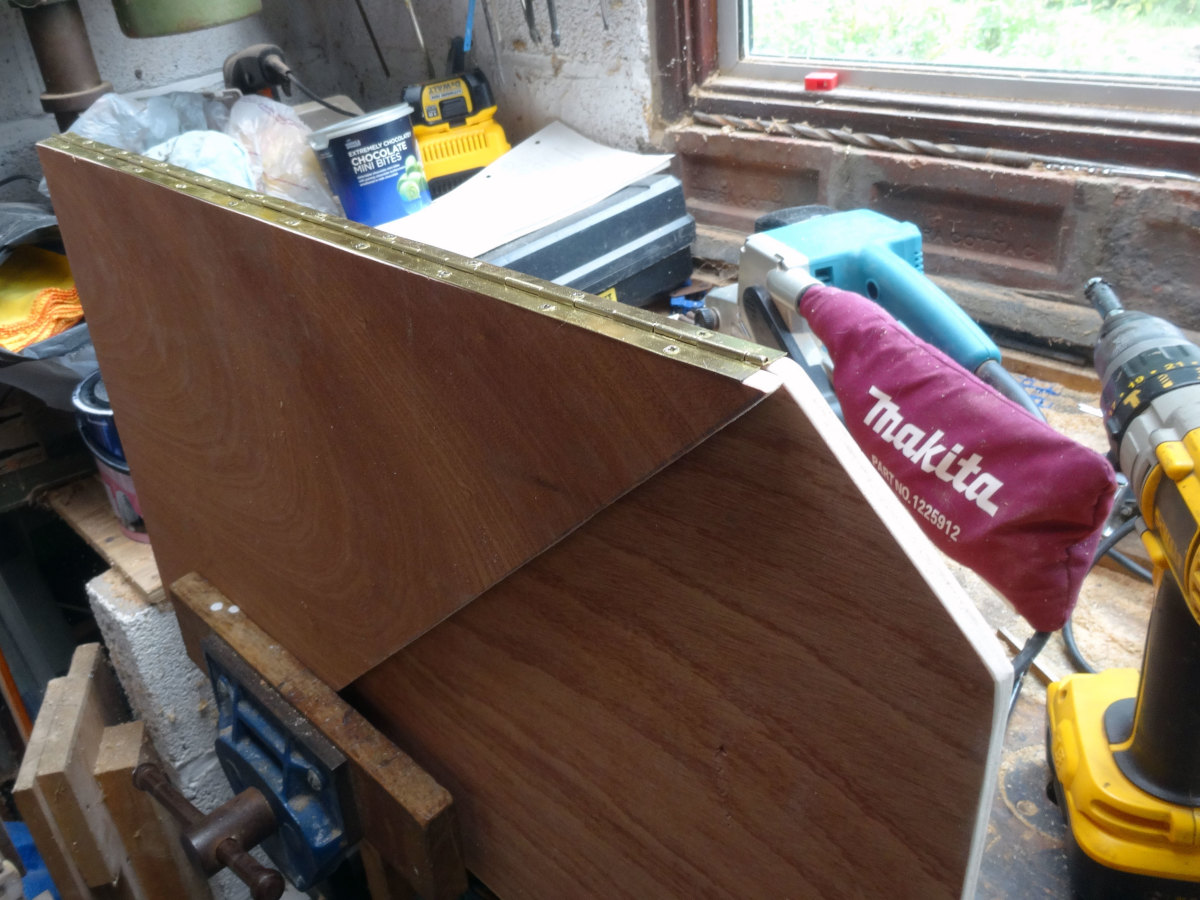 Hinging the two door sections together with piano hinge