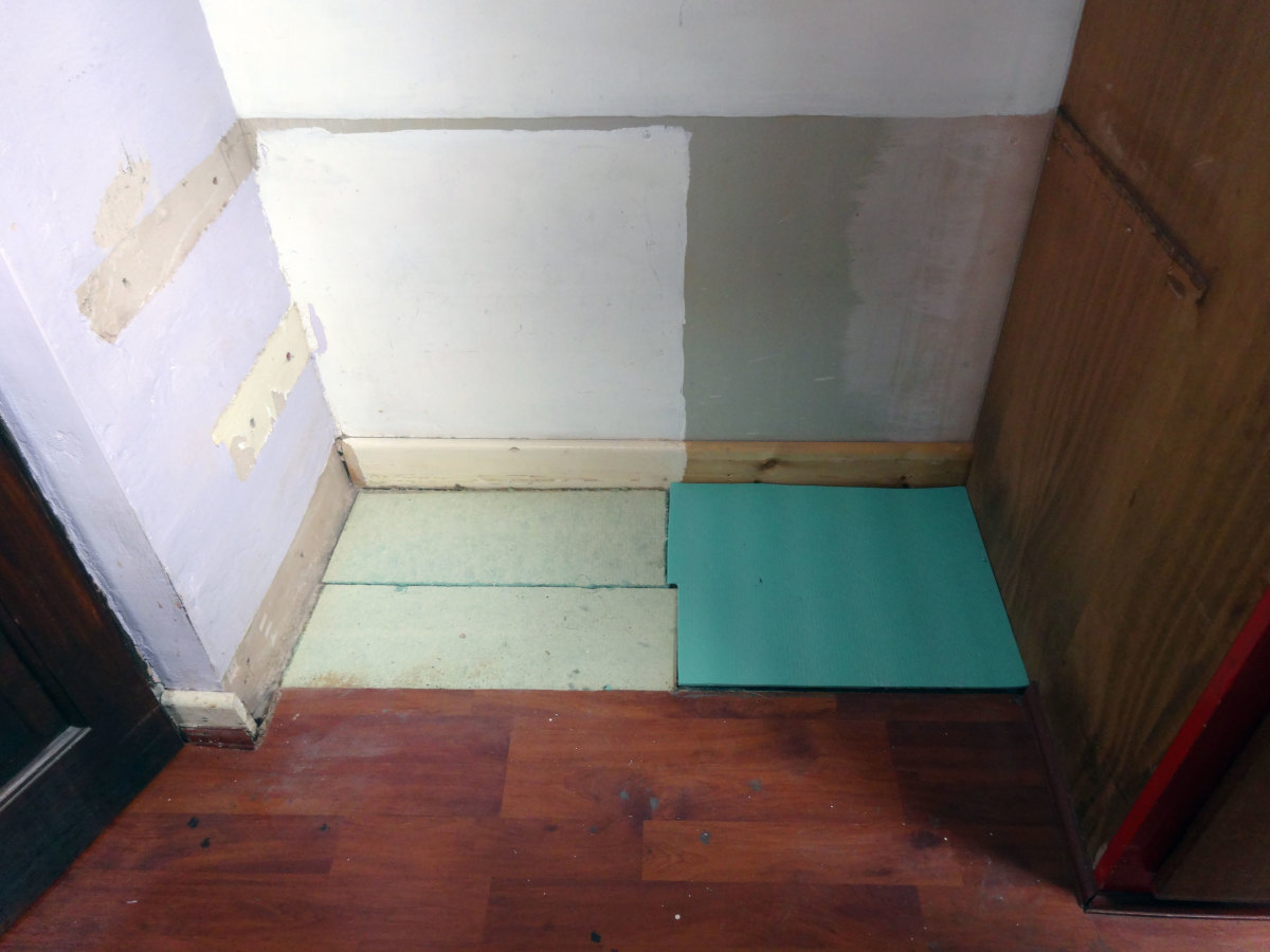 Adding a piece of spare underlay which I had in my shed, in the corner to match the existing