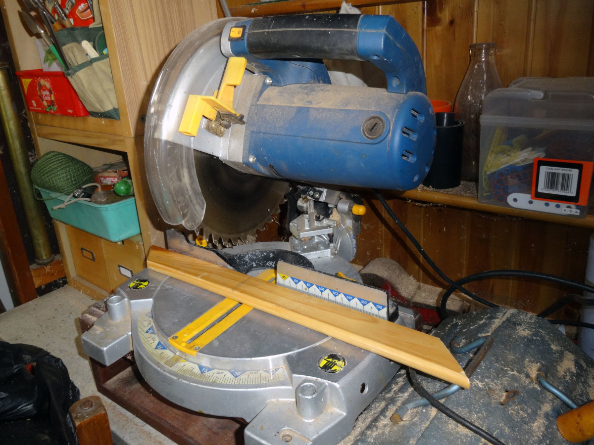 Using the bench mitre saw to cut the facings to size.