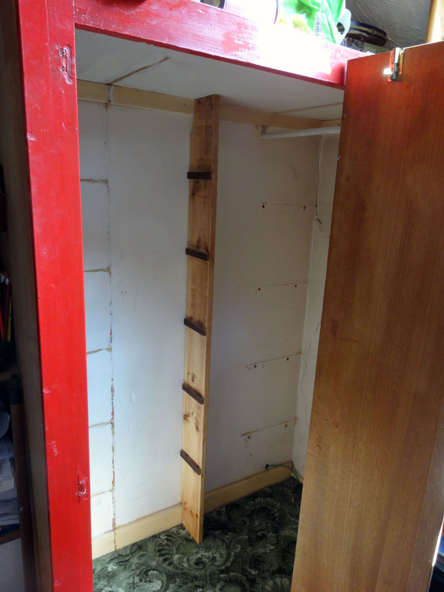 Bookcase side panel wedged into location, ready to fit the shelves.
