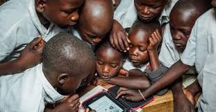 Kids mesmerized by a Kindle